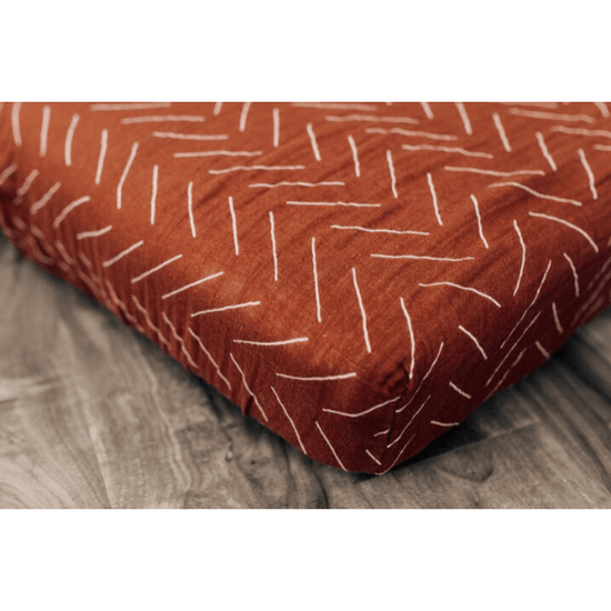 cotton muslin crib sheet, rust mud cloth bug + bean kids